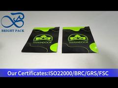 green and black small plastic stand up ziplock bag